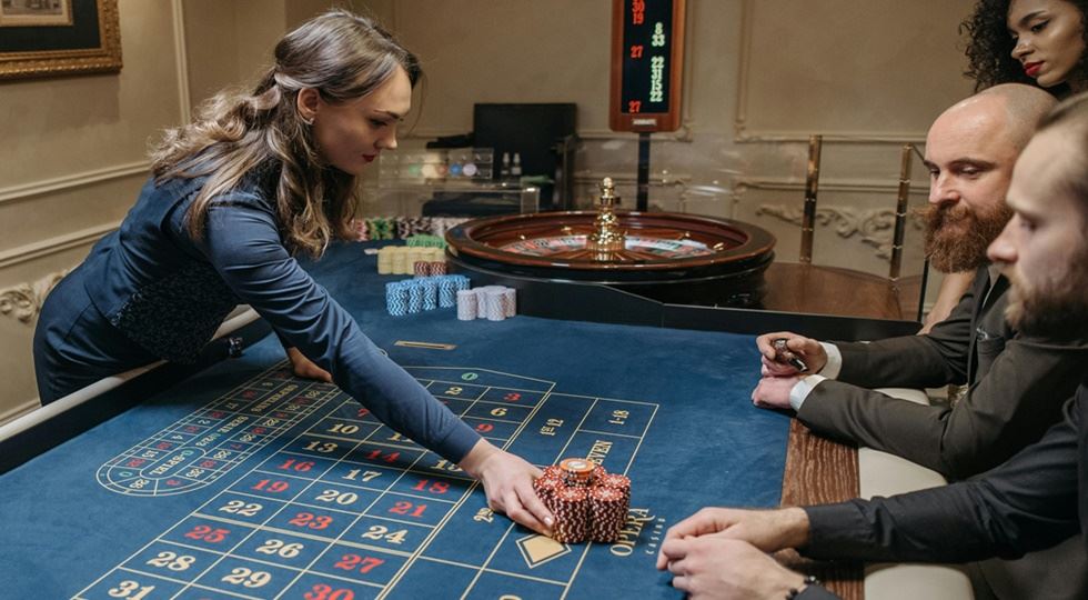 (Photo by Pavel Danilyuk: https://www.pexels.com/photo/men-playing-roulette-in-casino-7594348/)